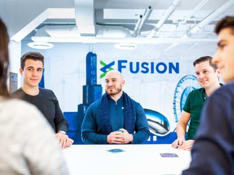 Three smiling businessmen in a conference room