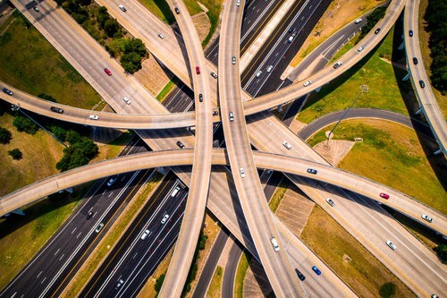 Amber Abstract Aerial Straight down view Curved highways and Interchanges and Overpasses aerial drone high above