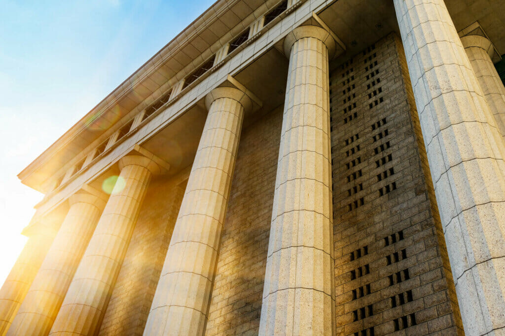 Grey marble column details on building - Fusion Risk Management