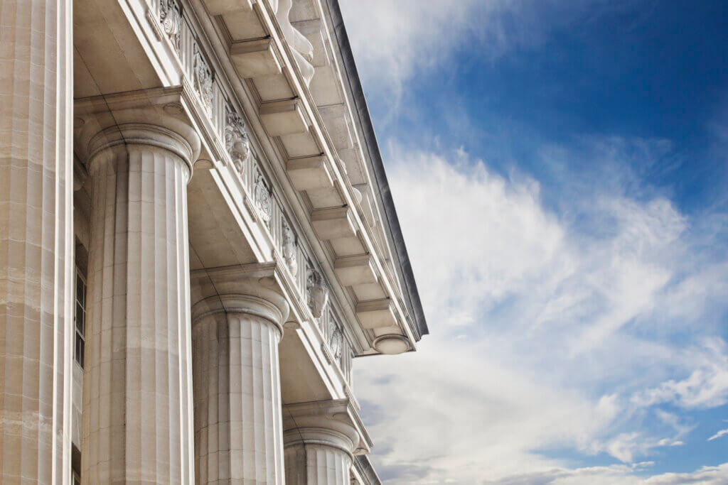 A close up look at a courthouse or government building with lots of copy space to the right